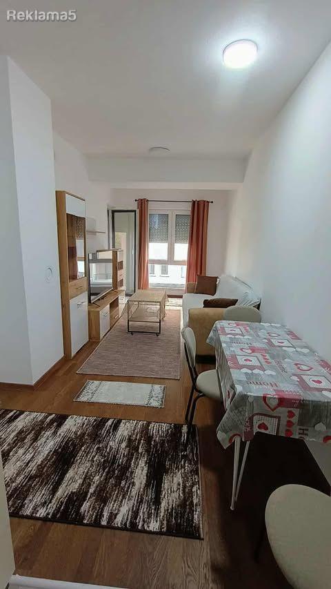 A new, fully furnished apartment is for rent.