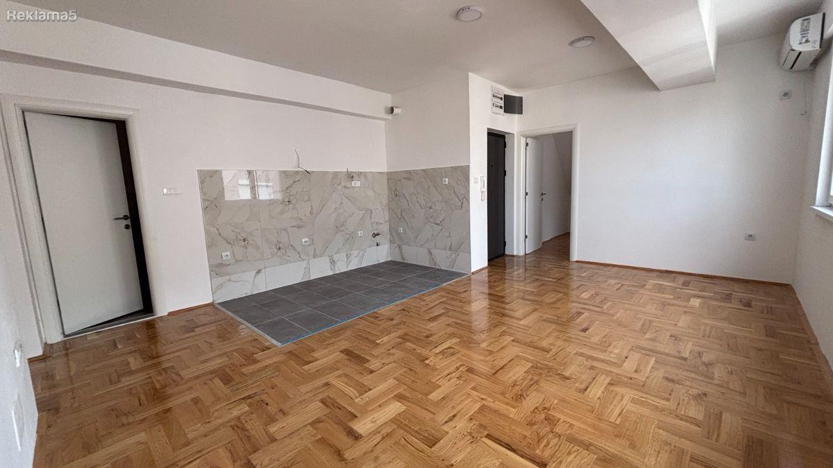 A modern apartment with a roof terrace is for sale in Hrom Skopje