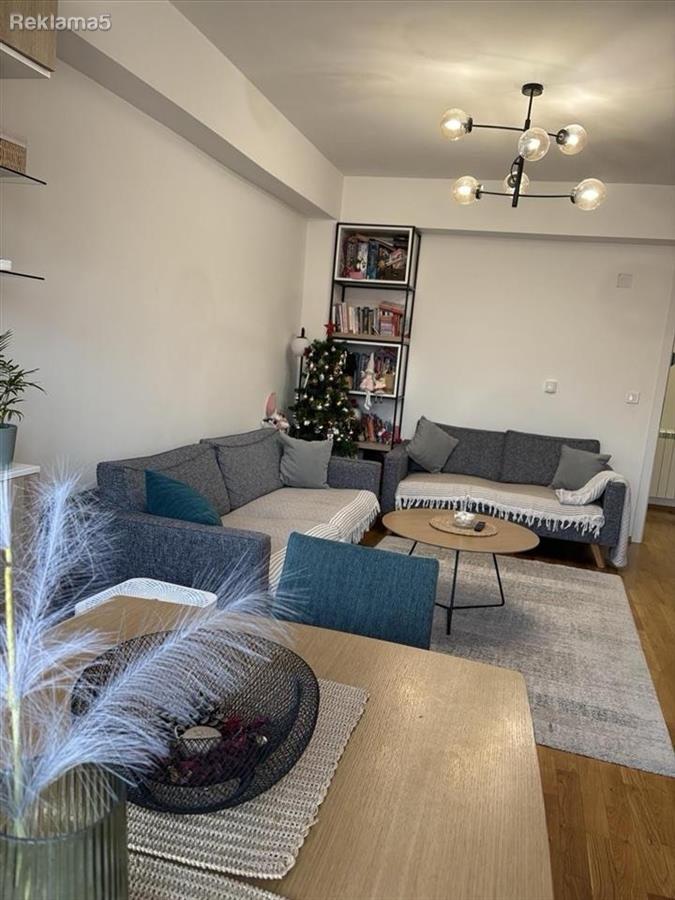 A new furnished three-room apartment in the Center is for sale