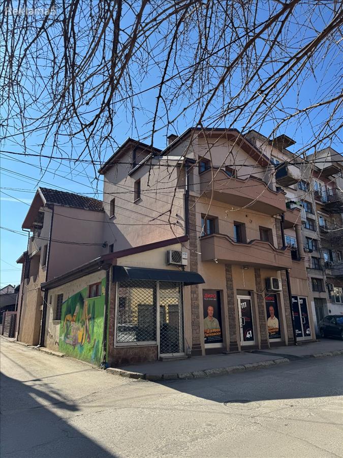 A house with office space and three residential units is for sale