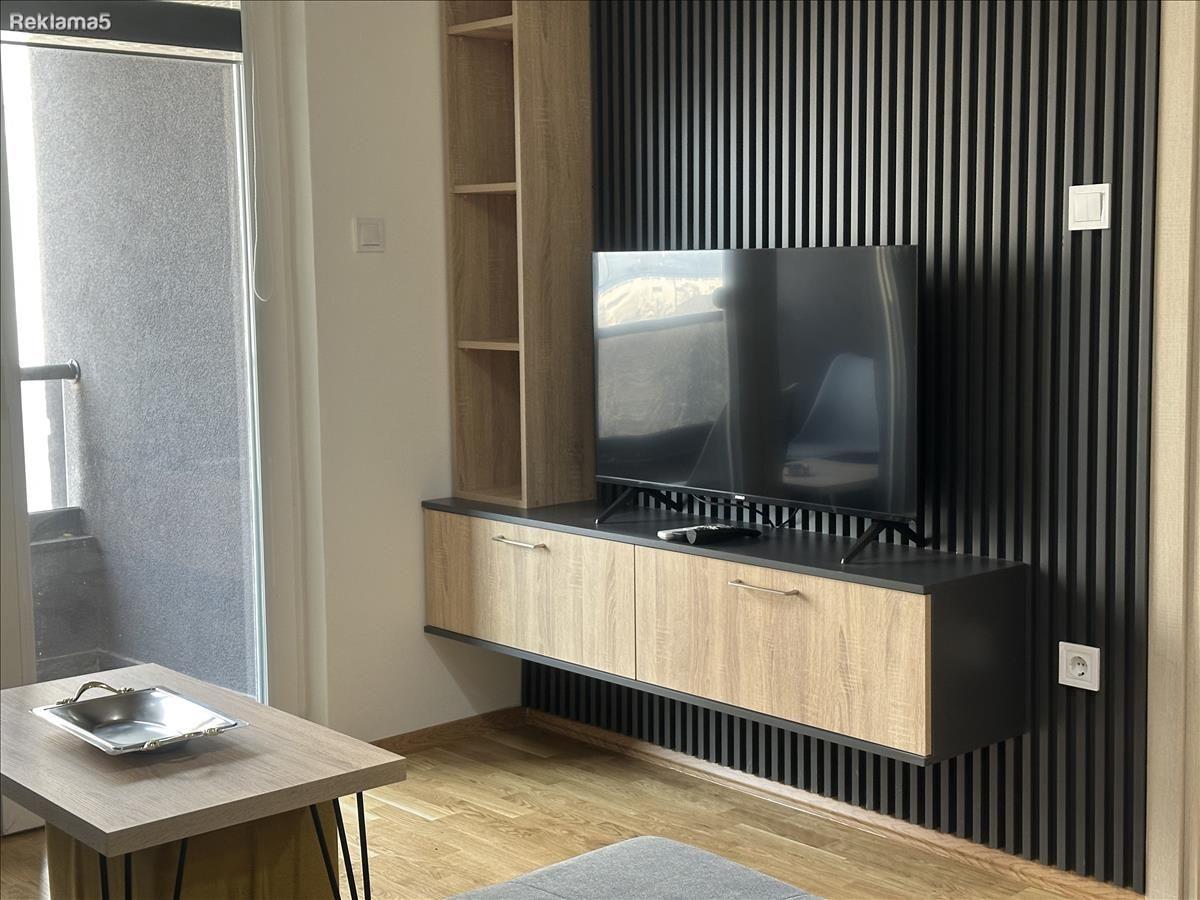 A modern apartment with a parking space in the Airport is for rent