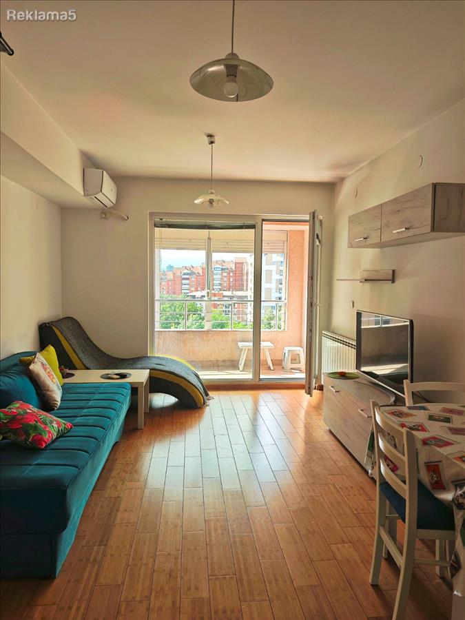 A furnished apartment with an underground garage in a new building is for rent