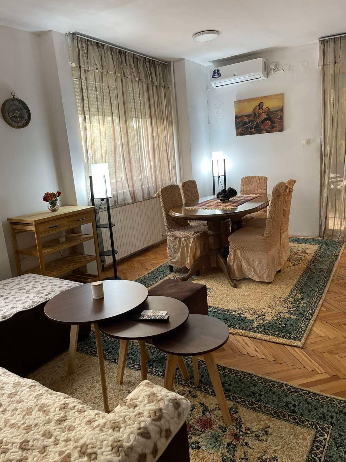 A furnished two-room apartment with a balcony and a 50m2 yard is for rent