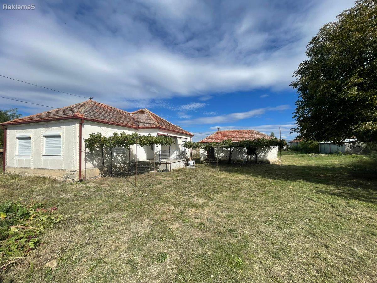 A completely renovated house with a yard is for sale
