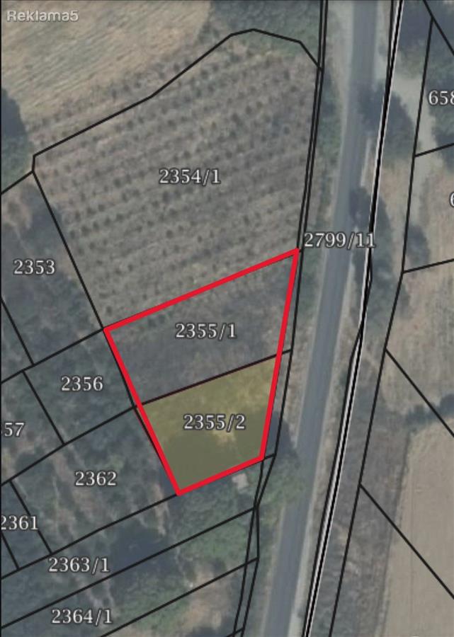 A field for sale opposite the Shimov gas station on asphalt